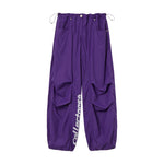 LETTERING PARACHUTE PANTS PURPLE